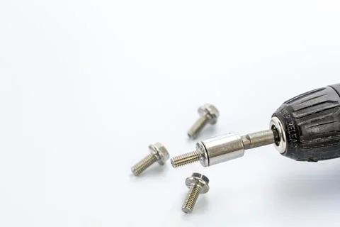 Close-up of a black grip release screwdriver with hex socket bit and four s.. Stock Photos