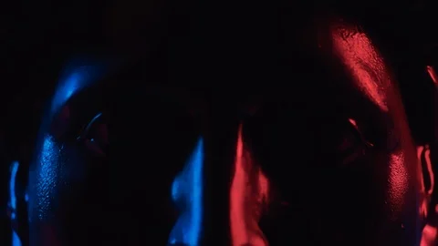 Close up of black gypsum head of Apollo statue in blue and red neon light Stock Footage 124225873