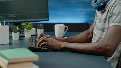 Close up of black hands coding server interface with binary codes Stock Photos