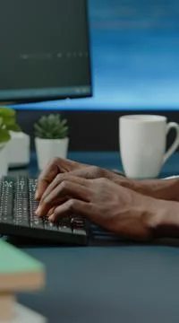 Close up of black hands coding server interface with binary codes Stock Photos