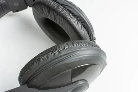 Close-up of black headphone on white background Stock Photos