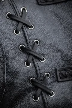 Close-Up of Black Leather Jacket Lacing. This image shows a close-up of the.. Stock Photos