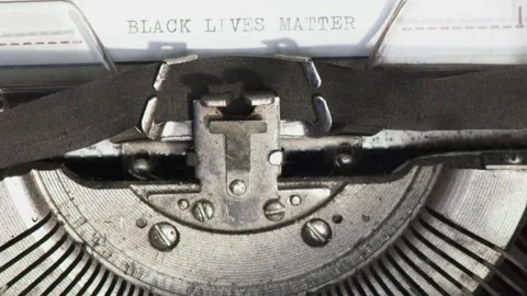 Close up BLACK LIVES MATTER being typed on vintage typewriter Stock Footage 185199190