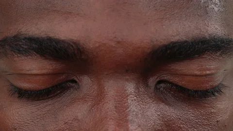 Close up of a black man face opening his eyes. Macro. Stock Footage 161952509
