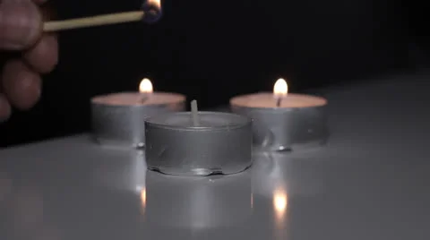 Close up black man lighting candle Stock Footage 23053489