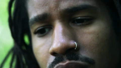 Close Up Black Man Looking Down With Concern, Shallow Focus 스톡 동영상 142013113