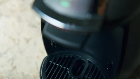 Close Up Black Man Making Coffee Using Automatic Capsule Machine Stock Footage 128801481