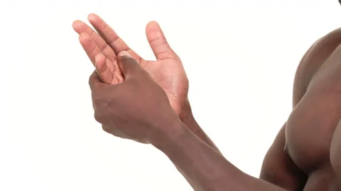 Close up of a black man massaging his hand. Isolated on a white background. Stock-Footage 161954953