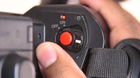 Close up of black man operating record button on Camcorder Stock Footage 140963142