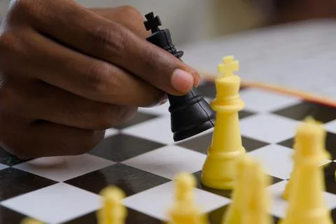 Close up of black man playing chess Concept of business competition and str.. Stock Photos