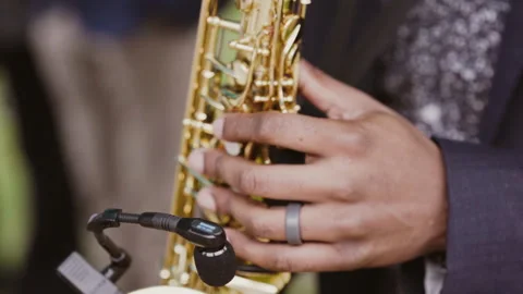 Close-up of a black man playing jazz on saxophone Stock Footage 244112161