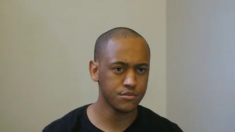 Close up of Black man putting on face mask in slow motion Stock Footage 126798807