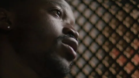 Close Up of Black Man Talking through Lattice Screen during Confession Stock Footage 318339895