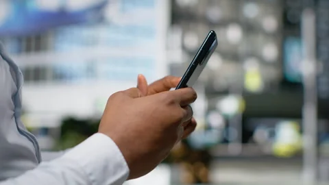 Close up of black man using online map and navigation for a stroll Stock Footage 324266387