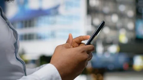 Close up of black man using online map and navigation for a stroll Stock Photos