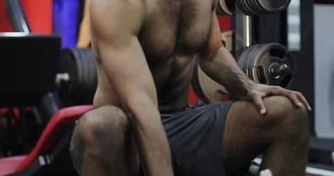 Close up of a black man's bare muscles in a gym. Stock Footage 101334653