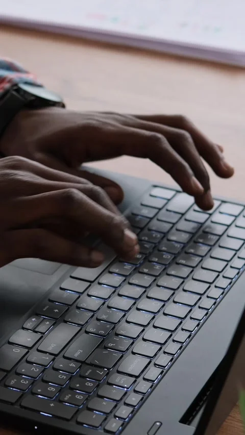 Close-up of a Black Man's Hands Typing on a Laptop Keyboard Stock Footage 326145761