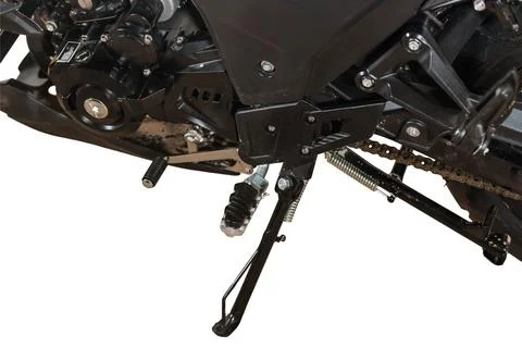 Close up of black motorcycle engine and rear suspension with chain drive on.. 库存照片