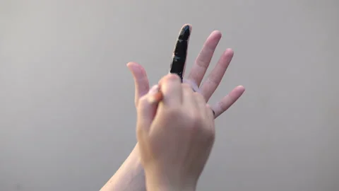 Close up of black paint on palm Stock Footage 139068152