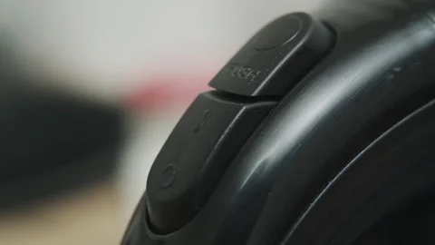 Close up of black plastic appliance with flush button and switch in home kitchen Stock Footage 340406669