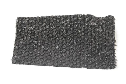 Close up of black plastic bubbles on a bubble wrap isolated by white backgr.. Stock Photos