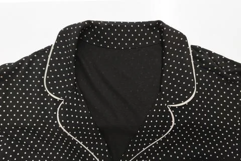 A close up of a black polka dot collar on a white background 写真素材