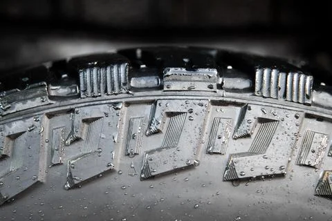 Close-up of black off-road tire tread pattern background side view Stock Photos