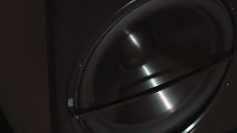 Close-up of black round audio speaker pulsating and vibrating from sound on low Stock Footage 92165279