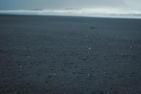 Close up black sand with small rocks concept photo Фото