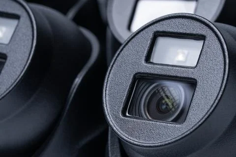 Close-up of a black security camera against the background of other cameras Stock Photos