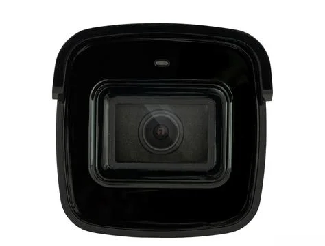 Close-up of a black Security camera lens isolated on a white background, Foto stock