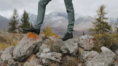Close-up of black shoes on rocks Video stock 274284485