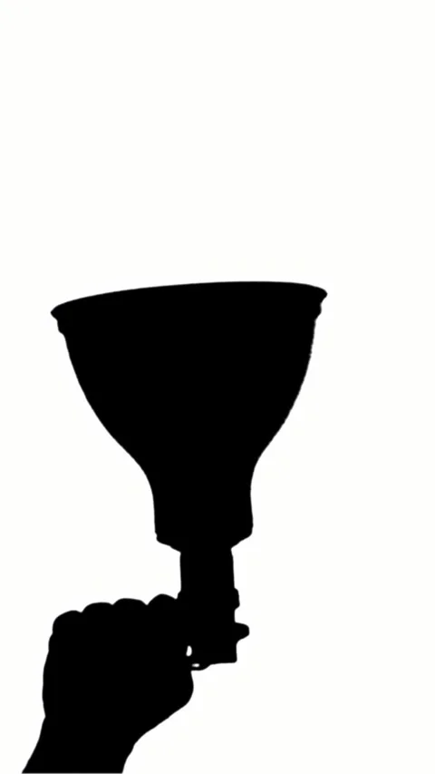 Close-up, black silhouette of megaphone. hand holds loudspeaker on white Stock-Footage 320346945