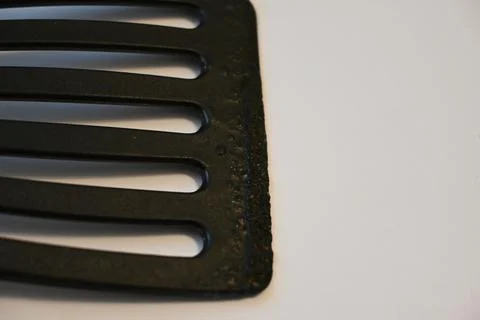 Close-up of a black slotted spatula 스톡 사진