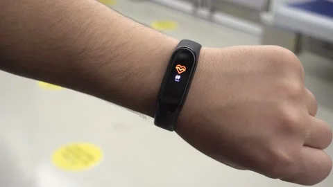 Close up black smartwatch displaying high rate of heartbeat per minute on wri Stock Footage 144487780