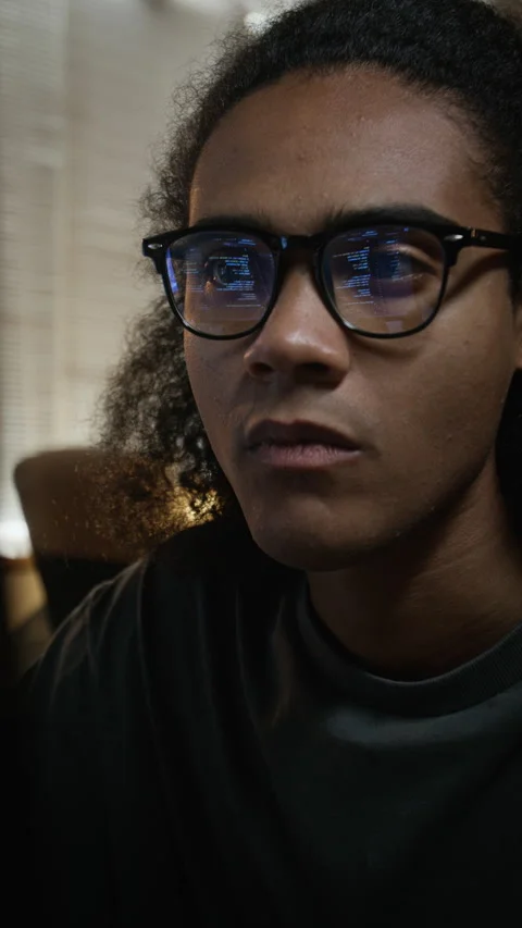 Close Up of Black Software Developer Coding with Screen Reflection in Glasses Stock-Footage 348152057