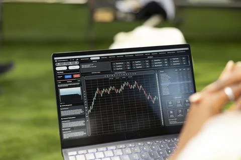 Close up of black student analyzing trading chart with financial data Stock Photos