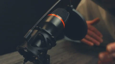 Close up of a black studio microphone with a pop filter and shock mount Stock Footage 333935841