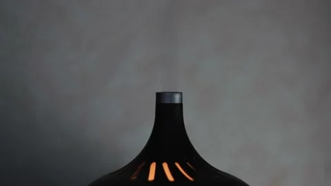 Close up of a black stylized air humidifier with colorful lights isolated on Stock Footage 157283312