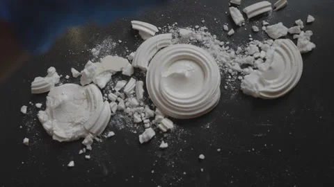 A close up of a black surface with white powder scattered on it Video stock 301621474