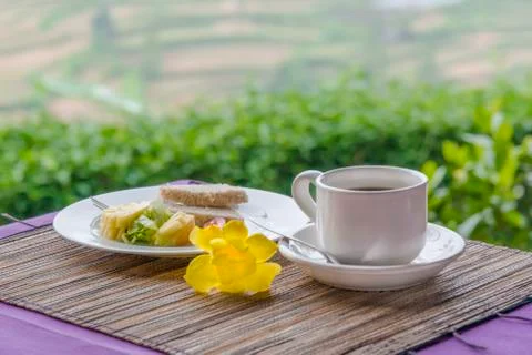 Close-up of black tea in white cup on the background of desert Stock Photos