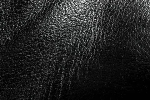 Close-up of black textured leather surface with shine Stock Photos