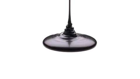 Close-up of black thick liquid is pouring on white surface. Slow motion. Stock-Footage 194127820