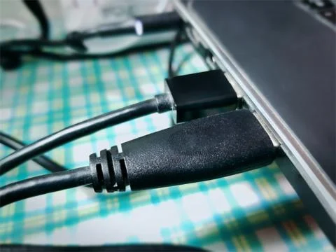 Close-up Black USB Cable Connected to a Laptop Stock Photos