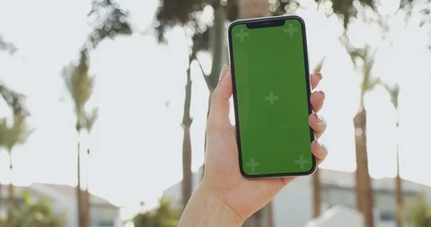 Close up of the black vertical smartphone with green screen and tracking motion Stock Footage 117043853