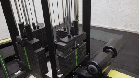 Close up of black weight stack with green numbered markers on gym machine Stock Footage 324755539