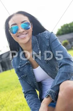 Close Up Of Black Woman In Sunglasses Smiling