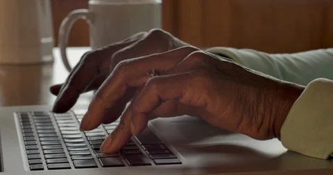 Close up of a black woman's hands typing on a laptop keyboard Stock Footage 91795608