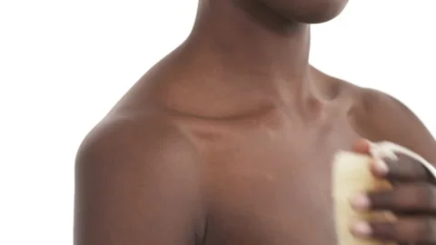 Close-up of black woman's upper body. Girl massaging her shoulder with Video stock 135917490