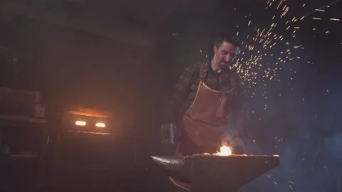 Close-up of a blacksmith forging hot metal Stock Footage 146580721